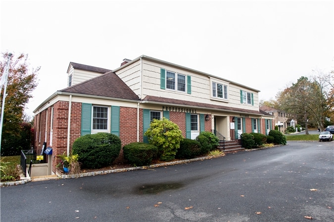Another angle of exterior dental office showing front lot, part of dental office in green village, nj services provided at Vaccaro Aesthetic and Family Dentistry in Green Village, NJ.